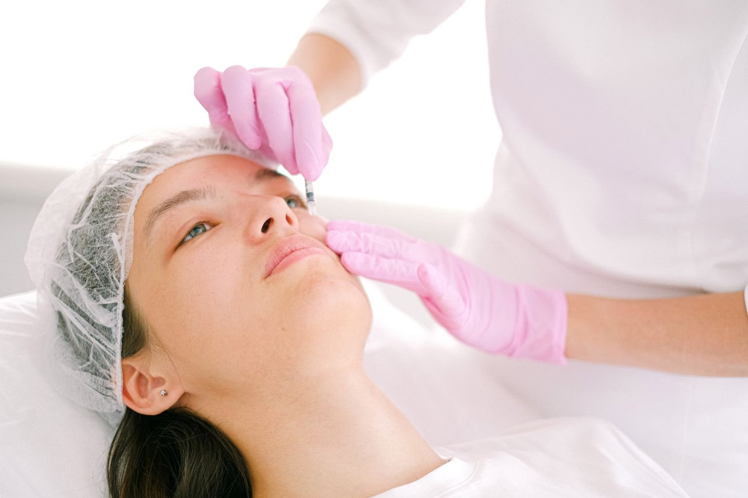 Dermal filler injection beside the smile line (nasolabial fold)